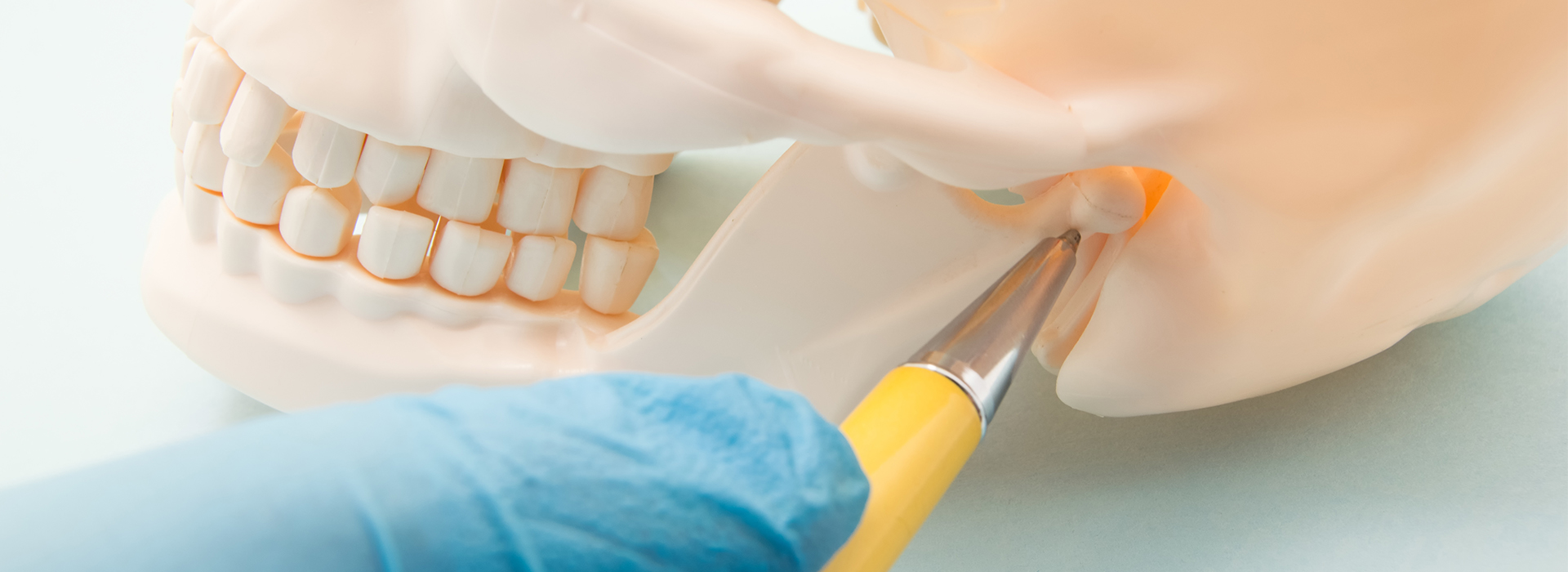 The image shows a close-up of a person s teeth being worked on by a dental professional, with a focus on the process of fixing or preparing a tooth.